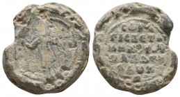 Byzantine lead seal of Chetames,
kouropalates and doux
 (ca 11th cent.)

Obverse: Saint Theodore stratelates, nimbate, standing facing, holding a spea...