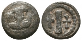 Byzantine lead coin of 10 nummia
(ca 6th/7th cent.)
Obverse: Bust of uncertain emperor, facial, between 2 stars, wreath border.

Reverse: Large I (for...