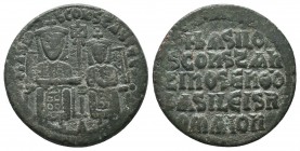 Basil I and Constantine,867-886.AE Follis. Constantinople,ca.568-870.Basil and Constantine seated facing, both crowned, holding labarum between them. ...