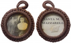 Ex indumentiis - Reliquiario di forma circolare con cornice in tessuto marrone con frammento di indumento sacro di Santa Domenica Mazzarello fondatric...