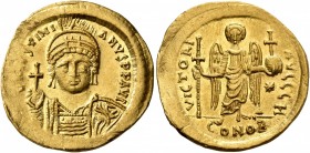 Justinian I, 527-565. Solidus (Gold, 21 mm, 4.45 g, 6 h), Constantinopolis, circa 538-545. D N IVSTINIANVS P P AVG Helmeted and cuirassed bust of Just...