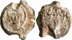 Justinian I, 527-565. Seal (Lead, 21 mm, 7.15 g, 11 h). Draped nimbate facing bust of Justinian I, wearing helmet with diadem and pendilia. Rev. Winge...