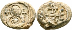 Theodoros, strator, 550-650. Seal (Lead, 20 mm, 8.95 g, 12 h). Nimbate facing bust of the Mother of God holding Christ, wearing a nimbus cruciger; cro...