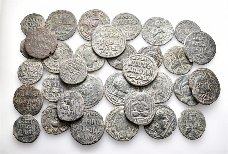 A lot containing 33 bronze coins. All: Islamic. About very fine to good very fin...