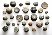 A lot containing 32 bronze weights. Includes: Byzantine and Islamic. About very fine to good very fine. LOT SOLD AS IS, NO RETURNS. 32 weights in lot.