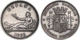PESETA SYSTEM: PROVISIONAL GOVERNMENT AND I REPUBLIC
Medalla Soberanía Nacional en plata. 1868. Anv.: Matrona tumbada con los pies en el Peñón de Gib...