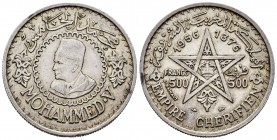 Morocoo. Mohamad V. 500 francs. 1376 (1956). (Km-Y54). Ag. 22,48 g. Choice VF. Est...35,00.   

SPANISH DESCRIPTION: Marruecos. Mohamad V. 500 francs....