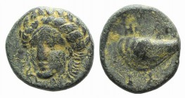 Aeolis, Gyrneion, 4th century BC. Æ (10mm, 1.58g, 3h). Laureate head of Apollo facing slightly l. R/ Mussel shell. SNG von Aulock 7689. Green patina, ...