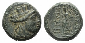 Ionia, Smyrna, c. 125-115 BC. Æ (15mm, 5.52g, 12h). Heras, magistrate. Turreted head of Tyche r. R/ Aphrodite Stratonikis standing r., resting arm on ...