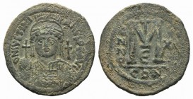 Justinian I (527-565). Æ 40 Nummi (40mm, 22.33g, 6h). Constantinople, year 12 (538/9). Helmeted and cuirassed bust facing, holding globus cruciger and...