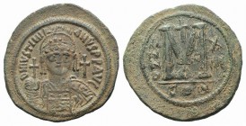 Justinian I (527-565). Æ 40 Nummi (42mm, 22.72g, 7h). Constantinople, year 17 (543/4). Helmeted and cuirassed bust facing, holding globus cruciger and...