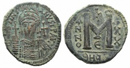 Justinian I (527-565). Æ 40 Nummi (36mm, 20.42g, 5h). Antioch, year 20 (546/7). Facing helmed and cuirassed bust, holding globus cruiciger. R/ Large M...