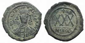 Tiberius II (578-582). Æ 30 Nummi (32mm, 12.15g, 6h). Nicomedia, 578-9. Crowned, draped and cuirassed facing bust. R/ Large XXX; cross above; NIKOA. M...