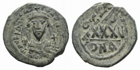 Phocas (602-610). Æ 40 Nummi (30mm, 11.34g, 6h). Constantinople year 6 (607/8). Crowned bust facing, wearing consular robes, holding mappa and cross; ...