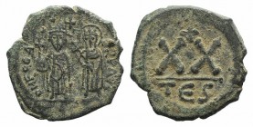 Phocas (602-610). Æ 20 Nummi (20mm, 5.06g, 6h). Thessalonica. Phocas, holding globus cruciger, and Sophia, holding cruciform sceptre, standing facing....