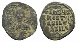 Anonymous, c. 976-1025. Æ 40 Nummi (26mm, 6.77g, 6h), Constantinople. Facing bust of Christ, holding Gospels; two pellets in each limb of nimbus. R/ L...