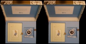 Fifty Pence 2018 The Tale of Peter Rabbit S.H44 Gold Proof FDC in the elaborate Royal Mint box, a large intricately decorated box reminiscent of a box...
