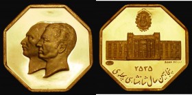 Iran - Golden Jubilee of the National Bank of Iran 21mm diameter, 4.87 grammes of .900 gold Obverse: Conjoined busts left, of the Shah and his father,...