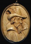 A miniature portrait of King James I carved in bone in high relief, of good style, within a thin brass frame, an unusual item, in good second-hand con...