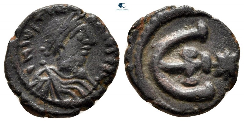 Justinian I AD 527-565. Theoupolis (Antioch)
Pentanummium Æ

13 mm., 2,01 g....