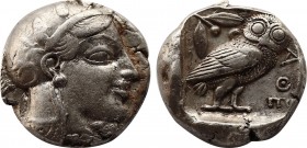 Greek
Attica. Athens circa 470-465 BC. Transitional issue
Tetradrachm AR
22,6mm., 17,14g.
Head of Athena with profile eye to right, wearing disc e...