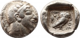 Greek
Attica. Athens circa 470-465 BC. Transitional issue
Tetradrachm AR
24,4mm., 17,2g.
Head of Athena with profile eye to right, wearing disc ea...