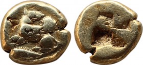 Mysia, Kyzikos EL hemihekte . Circa 500-450 BC. Winged dog seated to left, head reverted to right; tunny fish below to left / Quadripartite incuse squ...