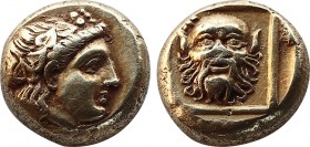 Lesbos, Mytilene EL Hekte. Circa 377-326 BC. Wreathed head of Dionysos right / Facing satyr’s head within linear square, all within shallow incuse squ...