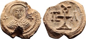 Byzantine Lead Seal (7th Century)

Obverse, Mary, frontal. Jesus in the medallion on his chest. Cross on the right and left. Pearl border. Broken chan...