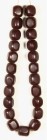 AFRIKA. 
KETTEN. Kopal-Perlenkette: 23 dunkelbraune Perlen (Wasserbüffel) mit 4 Phasen 35 x 40mm (würfelförmig), Gesamtlänge 110cm. .