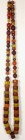 AFRIKA. 
PERLEN. Strang alter und seltener Karneolperlen zylinderförmige Gelbe und rötlichbraune Perlen F 12 -36mm ca. 77 Stück, Länge 152cm. .
