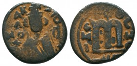 ARAB-BYZANTINE. Early Caliphate (636-660). Ae Fals. 

Condition: Very Fine

Weight: 4,1 gram
Diameter: 19,1