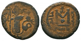ARAB-BYZANTINE. Early Caliphate (636-660). Ae Fals. 

Condition: Very Fine

Weight: 4,4 gram
Diameter: 18,5