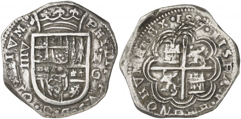 1597. Felipe II. Granada. M. 8 reales. (AC. 648). Tipo "OMNIVM". Dos restos de s...