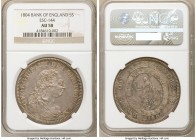 George III Bank Dollar of 5 Shillings 1804 AU58 NGC, KM-Tn1, ESC-144, S-3768. Prominent shadows from the host 8 reales are still evident towards the p...