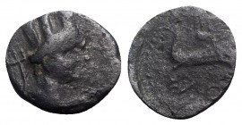 Spain, Carteia, c. 25 BC. Æ Quadrans (17mm, 3.33g, 9h). Turreted head of Fortuna r.; trident behind. R/ Cupid riding dolphin r. RPC I 116; ACIP 2609. ...