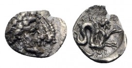 Campania, Allifae, c. 325-275 BC. AR Obol (11mm, 0.59g, 11h). Laureate head of Apollo r.; three dolphins around. R/ Skylla r., holding sepia and fish;...