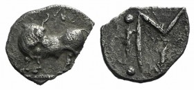 Southern Lucania, Sybaris, c. 550-510 BC. AR Obol (8mm, 0.30g, 9h). Bull standing l., head r. R/ Large MV monogram; four pellets around. HNItaly 1739;...