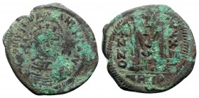 Justinian I (527-565). Æ 40 Nummi (37mm, 19.11g, 5h). Theoupolis (Antioch), year 34 (560/1). Helmeted and cuirassed bust facing, holding globus crucig...