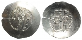 Manuel I (1143-1180). EL Aspron Trachy (33mm, 4.63g, 6h). Constantinople, c. 1160-1164. Christ Pantokrator standing facing on low daïs; stars flanking...
