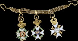GREECE: Three miniature medals (probably in gold 0,585) mounted on a gold bracelet. Order of Leopold I - Officer gold cross (Belgium) + Order of the R...