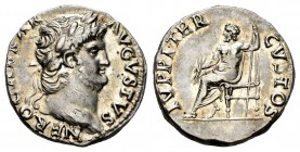 Nero. Denarius. 64-65 AD. Rome. (Ric-53). (Rsc-119). Anv.: NERO CAESAR AVGVSTVS, laureate head right . Rev.: IVPPITER CVSTOS, Jupiter seated left on t...