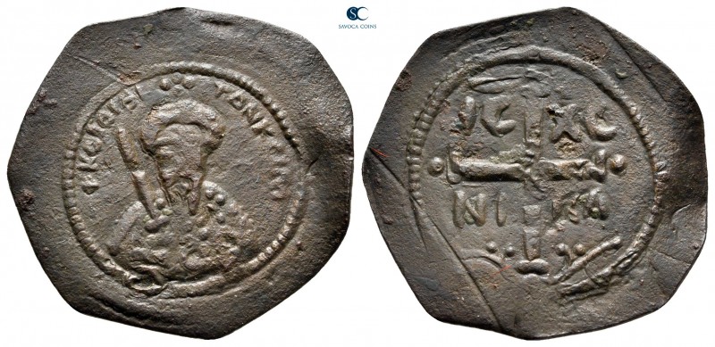 Tancred AD 1101-1103. Antioch
Follis Æ

27 mm, 2,77 g

Half-long figure of ...