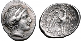 Elis, Olympia AR Stater. 114th Olympiad = 324 BC. Head of Hera to right, wearing stephane; F-A across lower fields / Eagle standing to right with open...