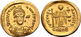Justinian I AV Solidus. Constantinople, AD 527-538. D N IVSTIИIAИVS P P AVC, helmeted and cuirassed bust facing three-quarters to right, holding spear...