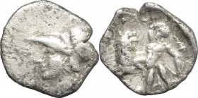 Greek Italy. Southern Apulia, Tarentum. AR Diobol, 300-230 BC. Obv. Head of Athena left, helmeted. Rev. Herakles, holding club overhead, kneeling left...
