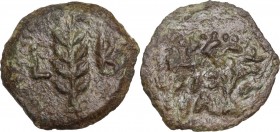 Greek Asia. Judaea. Tiberius (14-37). AE Prutah, Struck under Valerius Gratus. RY 2 (15/6 AD). Obv. OY/ΛIA in two lines within wreath. Rev. Palm frond...