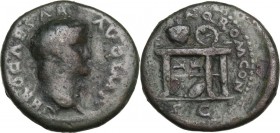 Nero (54-68). AE Semis, 64 AD. Obv. Laureate head right. Rev. Table bearing urn and wreath; on front of left panel, two gryphons standing facing one a...