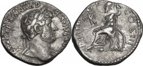 Hadrian (117-138). AR Denarius, 119-122 AD. Obv. Bust right, laureate, draped on left shoulder. Rev. Roma seated left on pile of arms, holding Victory...