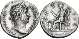Hadrian (117-138). AR Denarius, 128-129. Obv. Head right, laureate. Rev. Annona or Abundantia seated left, holding reaping hook and cornucopiae; befor...